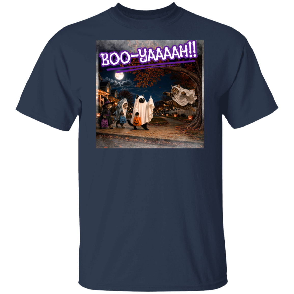 A navy blue short-sleeve t-shirt with a colorful graphic print of a Halloween night scene featuring cat's going trick or treating, and a cat jumping out from behind a tree, dressed as a ghost, to scare the other cats, and the text 'BOO - YAAAAAH!!' in purple neon, worn by a model. The cat that was the intended target is holding up it's middle finger under it's costume as an automatic response to the annoying ghost.