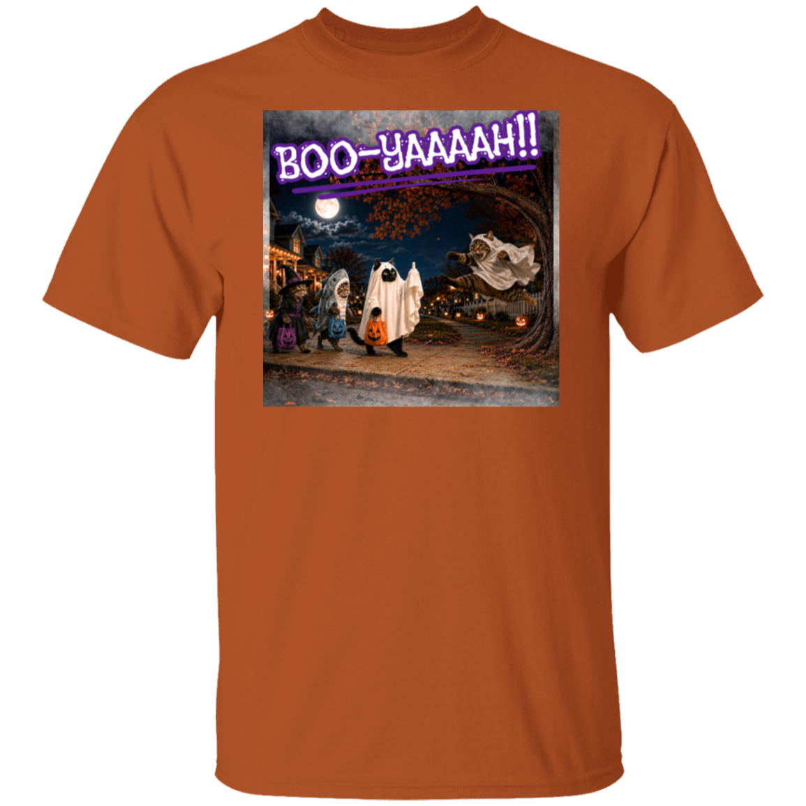 A orange short-sleeve t-shirt with a colorful graphic print of a Halloween night scene featuring cat's going trick or treating, and a cat jumping out from behind a tree, dressed as a ghost, to scare the other cats, and the text 'BOO - YAAAAAH!!' in purple neon, worn by a model. The cat that was the intended target is holding up it's middle finger under it's costume as an automatic response to the annoying ghost.