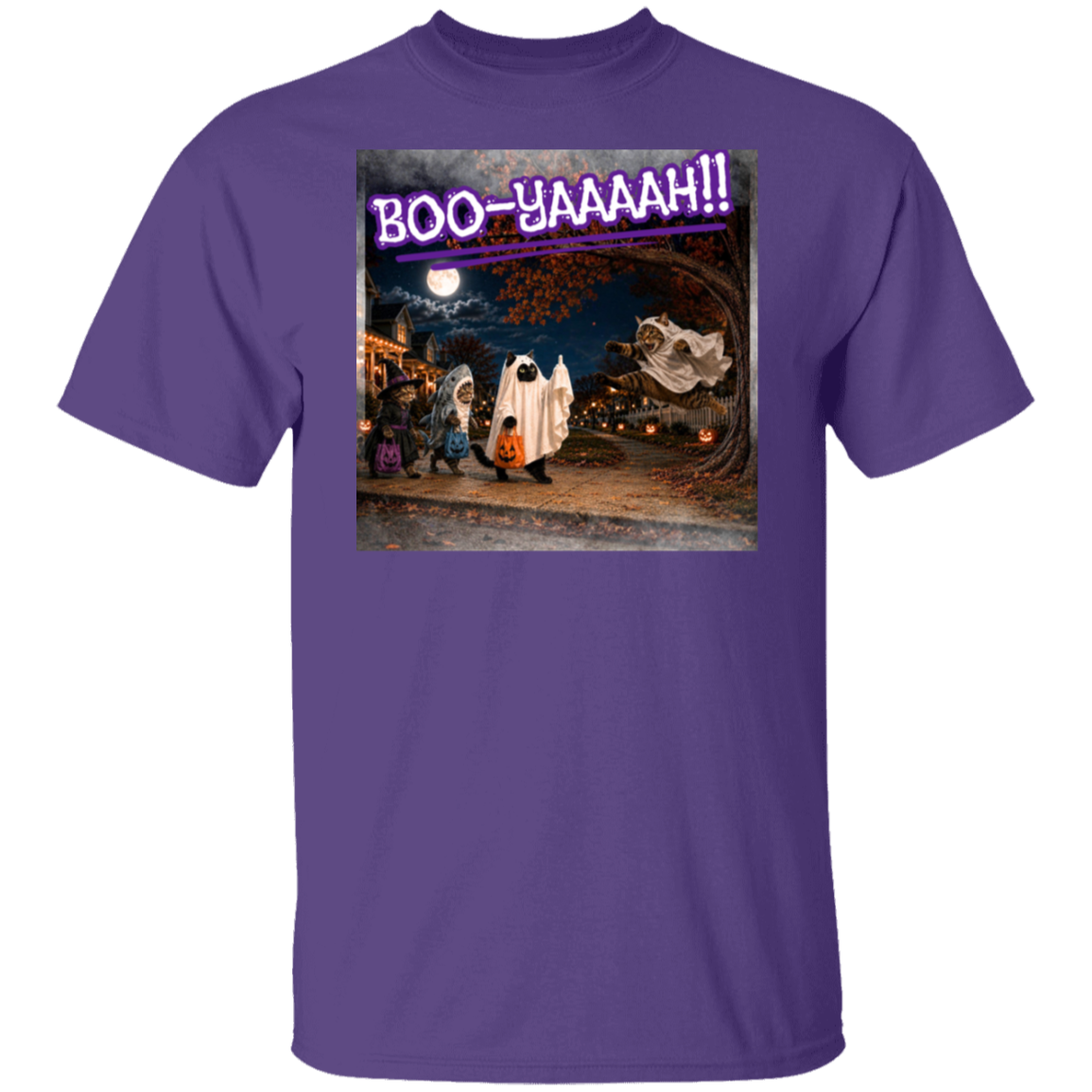 A purple short-sleeve t-shirt with a colorful graphic print of a Halloween night scene featuring cat's going trick or treating, and a cat jumping out from behind a tree, dressed as a ghost, to scare the other cats, and the text 'BOO - YAAAAAH!!' in purple neon, worn by a model. The cat that was the intended target is holding up it's middle finger under it's costume as an automatic response to the annoying ghost.