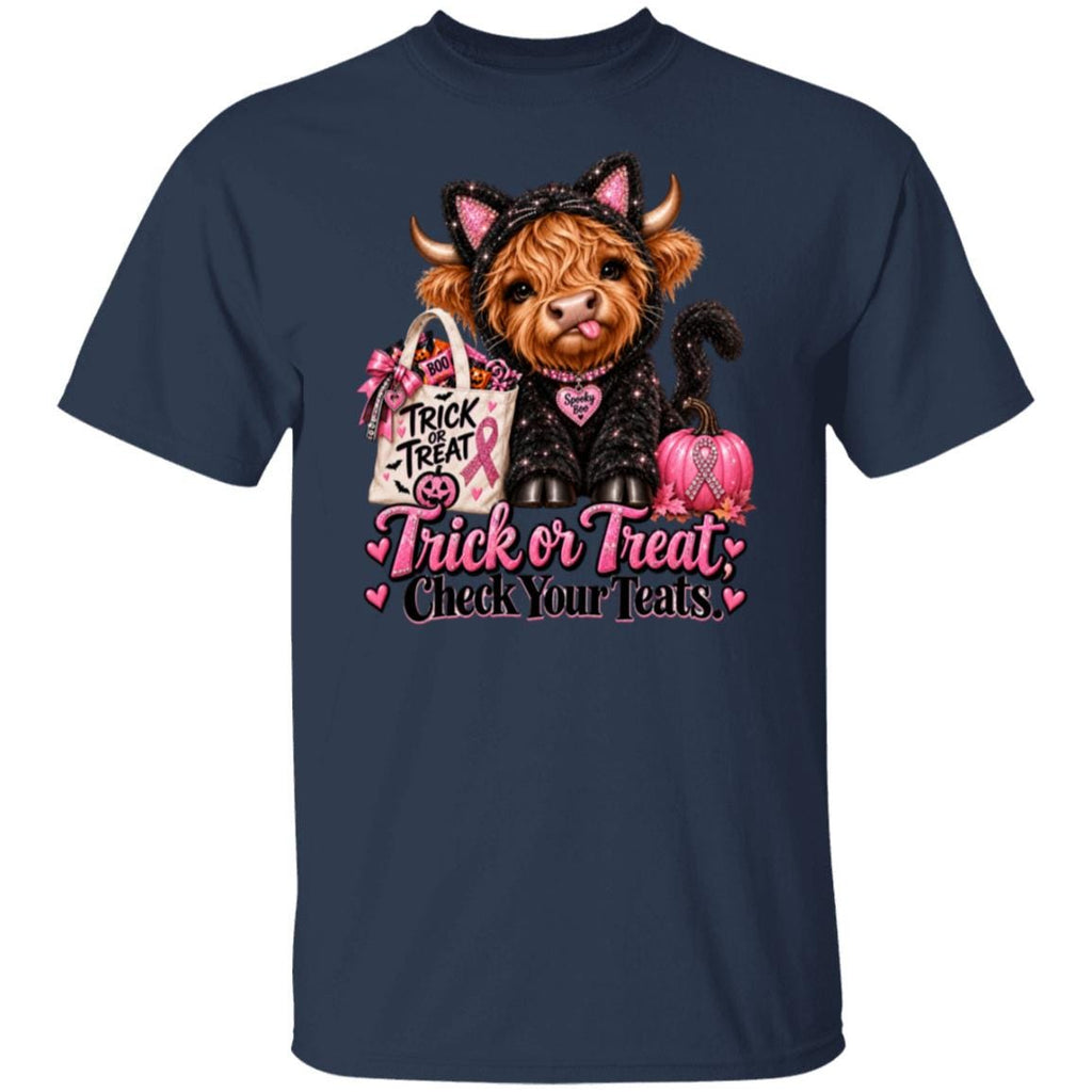 A navy blue short-sleeve crewneck t-shirt featuring a graphic of a fluffy brown highland cow dressed in a black cat costume with pink ears, holding a pink pumpkin and a shopping bag with the text 'Trick or Treat Check Your Teats'.