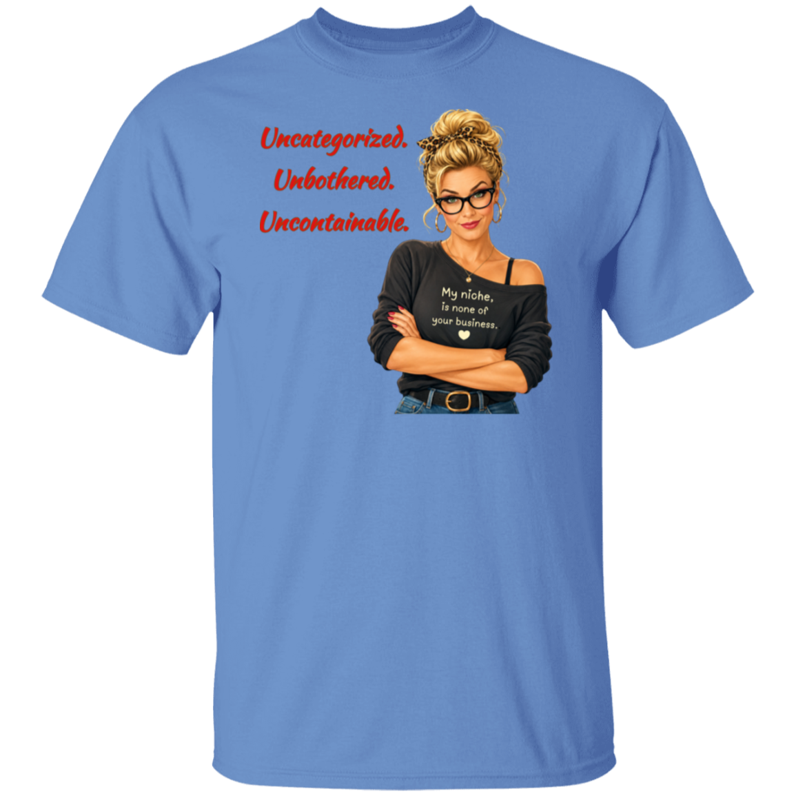 A Carolina blue short-sleeve t-shirt with a graphic print on the front. The graphic features a retro-style illustration of a blonde woman in glasses wearing a black off-the-shoulder shirt with the text  'My niche, is none of your business.", along with "Uncategorized", "Unbothered", "Uncontainable" written in red letters.