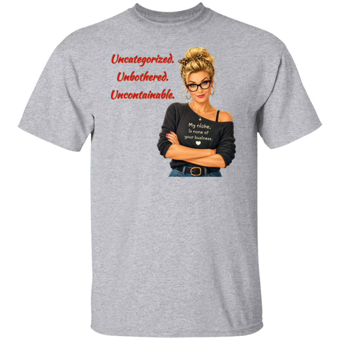 A heather gray short-sleeve t-shirt with a graphic print on the front. The graphic features a retro-style illustration of a blonde woman in glasses wearing a black off-the-shoulder shirt with the text  'My niche, is none of your business.", along with "Uncategorized", "Unbothered", "Uncontainable" written in red letters.