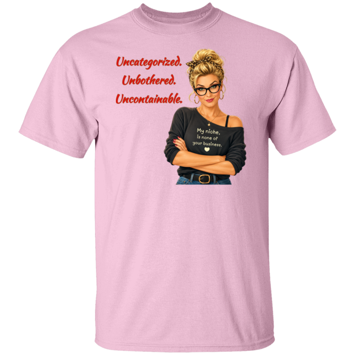 A light pink short-sleeve t-shirt with a graphic print on the front. The graphic features a retro-style illustration of a blonde woman in glasses wearing a black off-the-shoulder shirt with the text  'My niche, is none of your business.", along with "Uncategorized", "Unbothered", "Uncontainable" written in red letters.