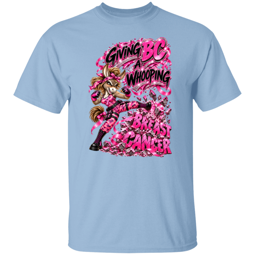 A light blue short-sleeve crewneck t-shirt featuring a large graphic print on the front. The graphic shows a cartoon donkey wearing pink camouflage clothing and boots, surrounded by pink ribbon graphics and the text 'GIVING BC A WHOOPING' in pink and black, white it's kicking block lettering BREAST CANCER.
